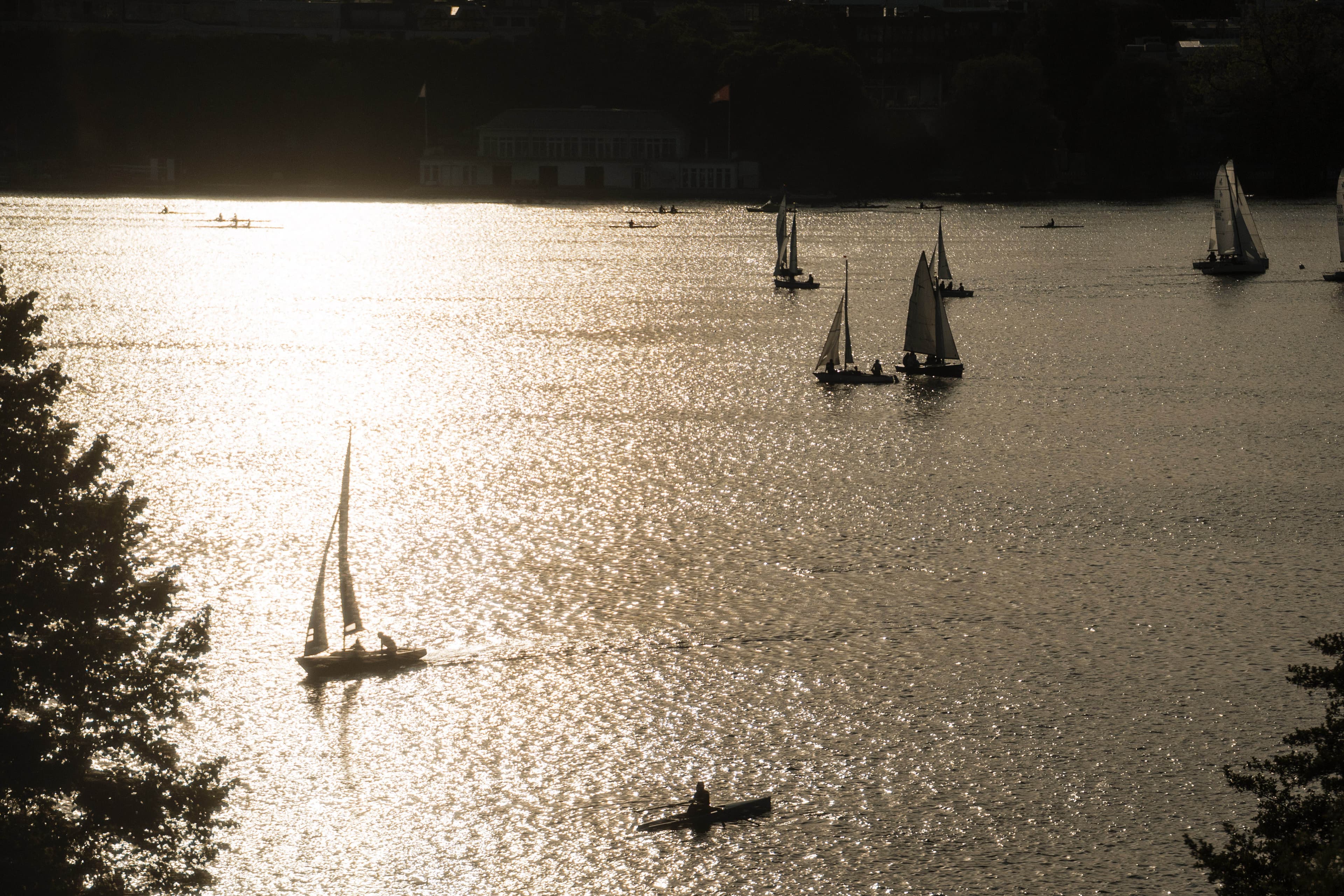 View of Aussenalster in Hamburg, with sailboats and kayak.