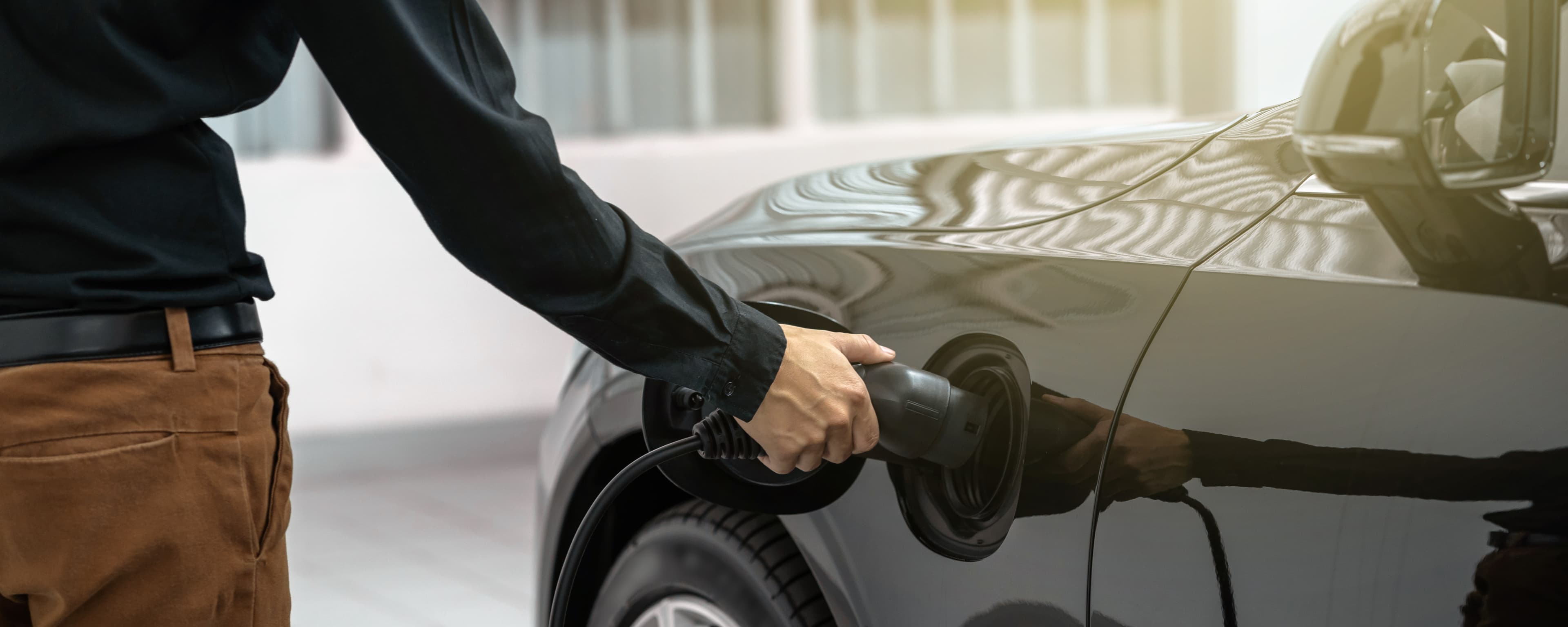 Man charging the EV car
