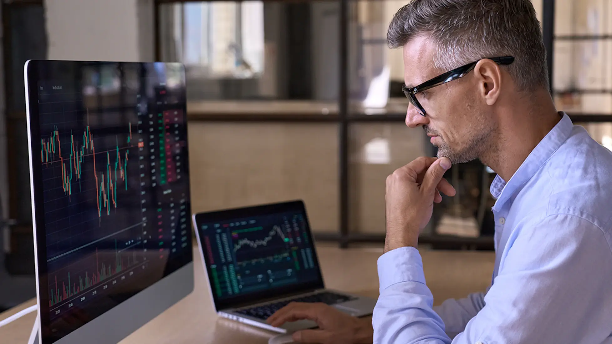 Man looking at the stock market charts