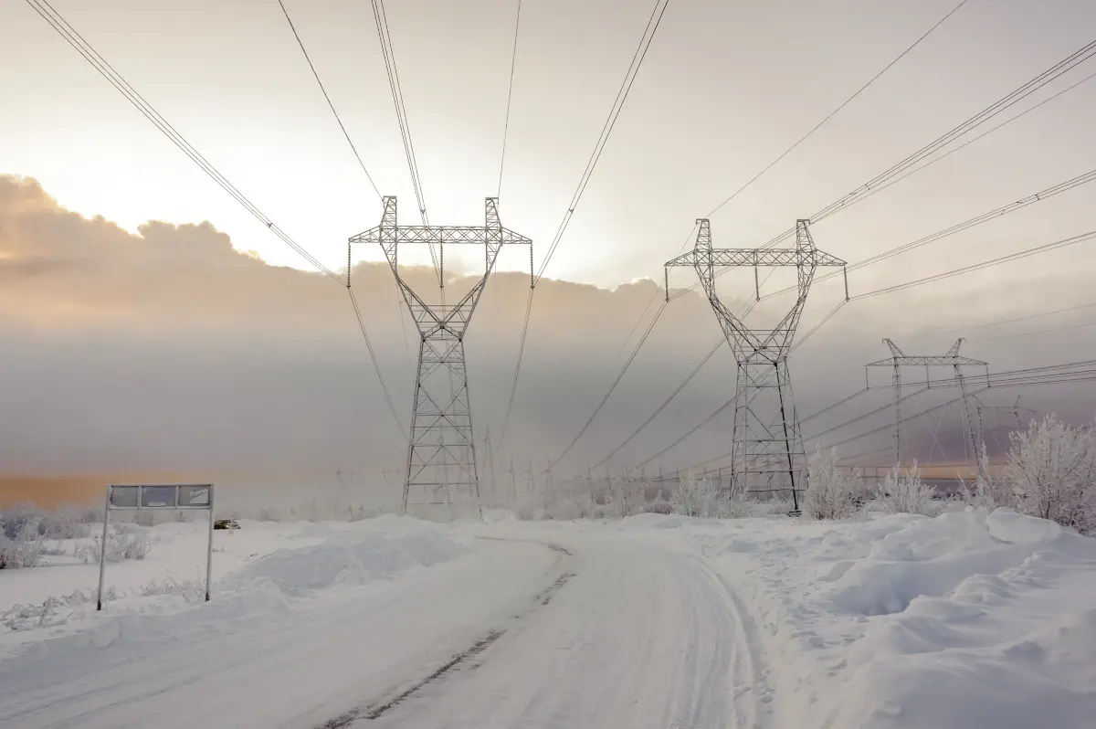 Power lines in the winter near the road