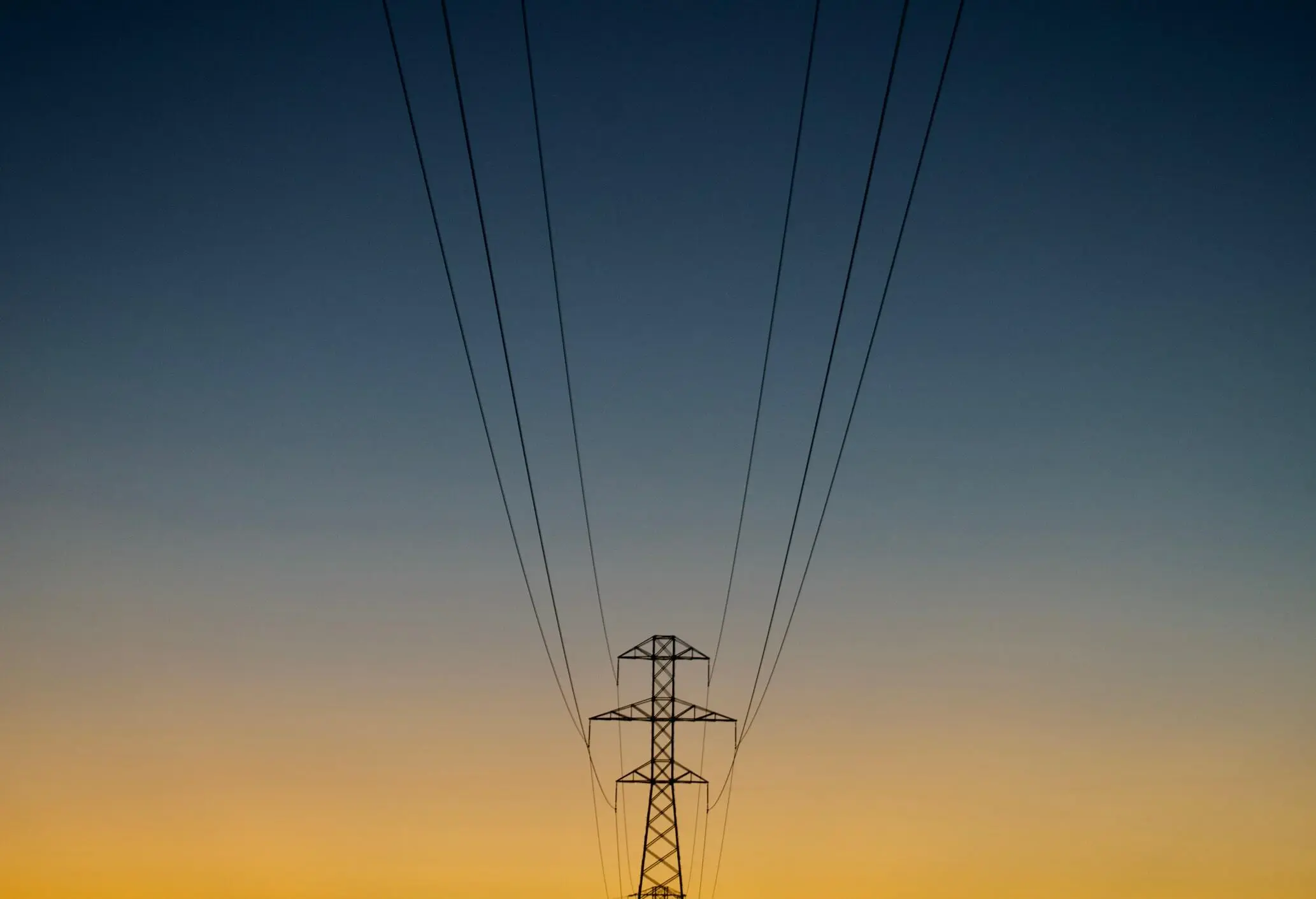Power gird poles at sunset