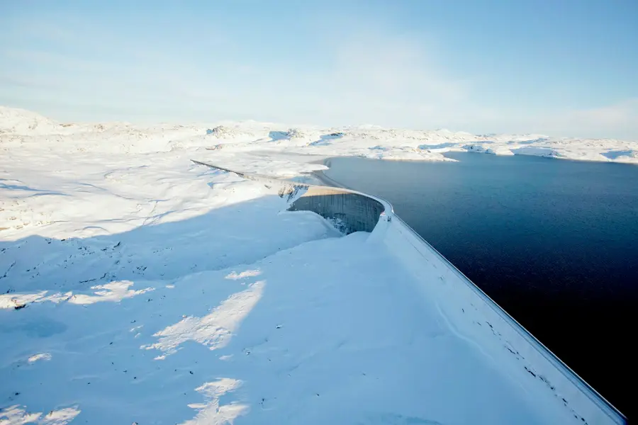 Image of a dam in the winter to represent Volue reports and presentations site