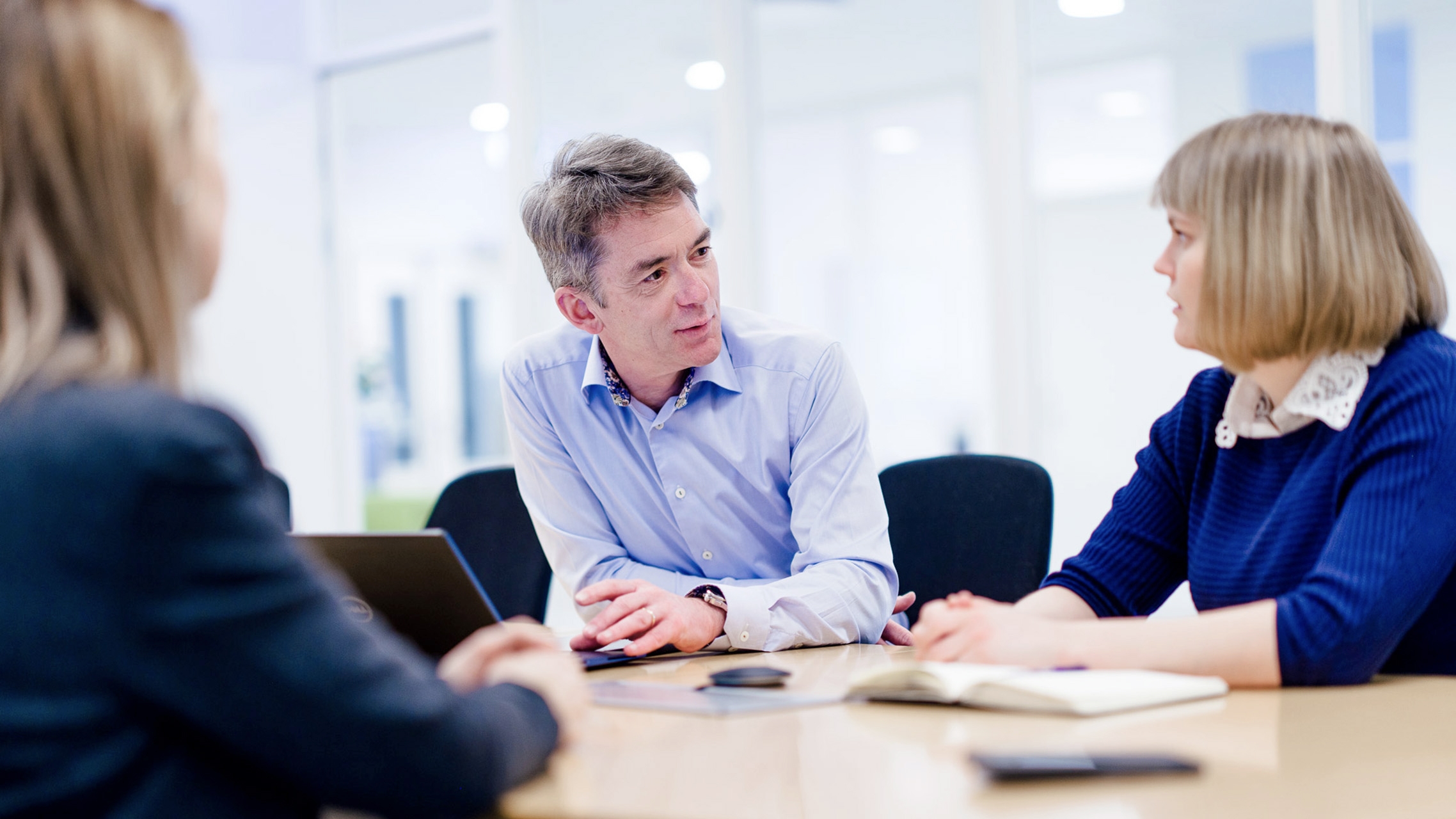 People discuss something at a table