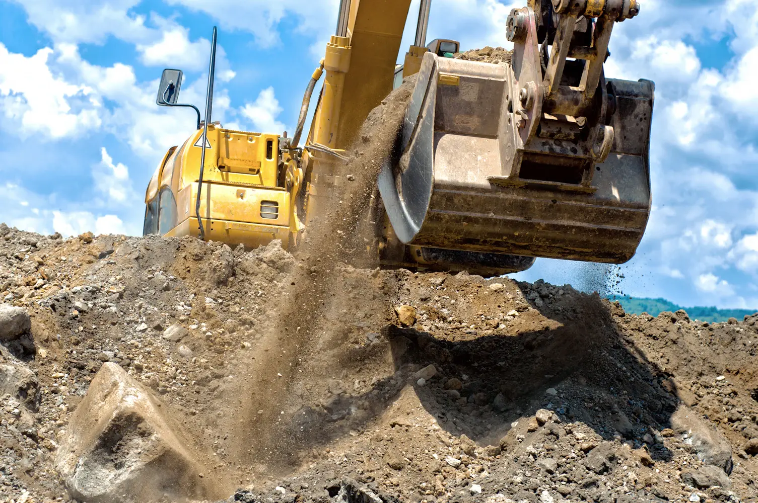 Excavator diging in the ground